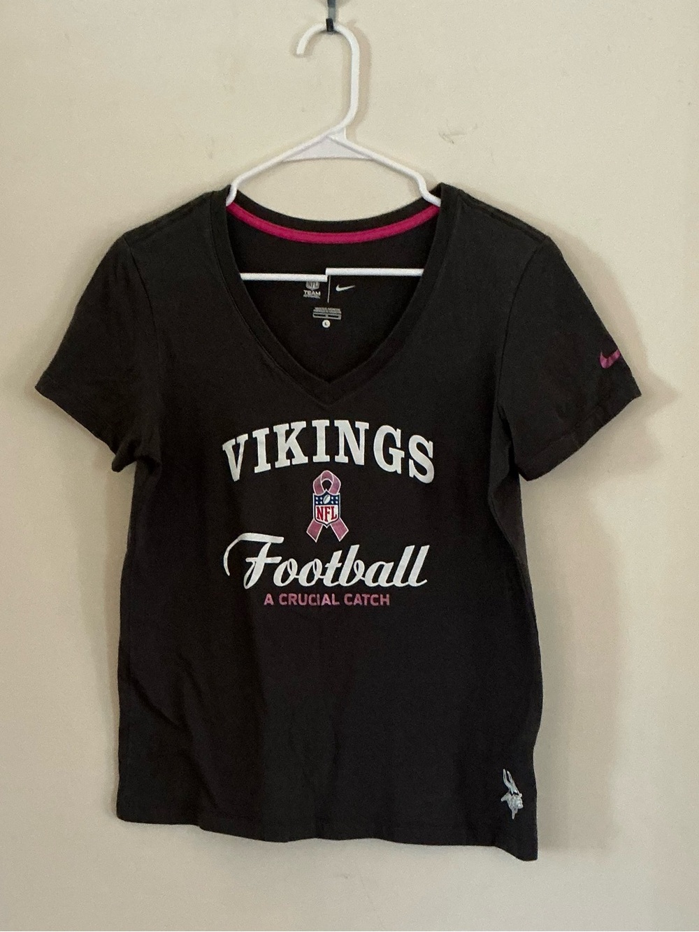 Nike Women’s Black V-Neck Vikings Football A Crucial Catch Tee with Pink Accents